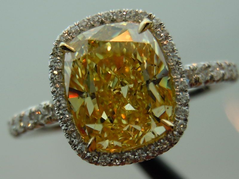 fancy intense yellow diamond engagement ring with halo
