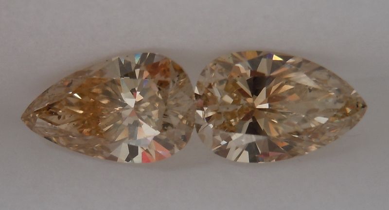 pair of brown pear shape diamonds