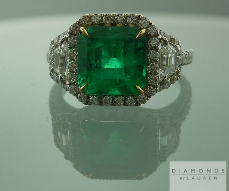 hand forged emerald and diamond halo ring