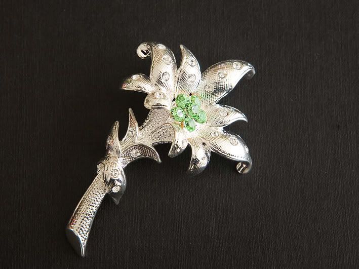 flower brooch w green crystal web - brooches