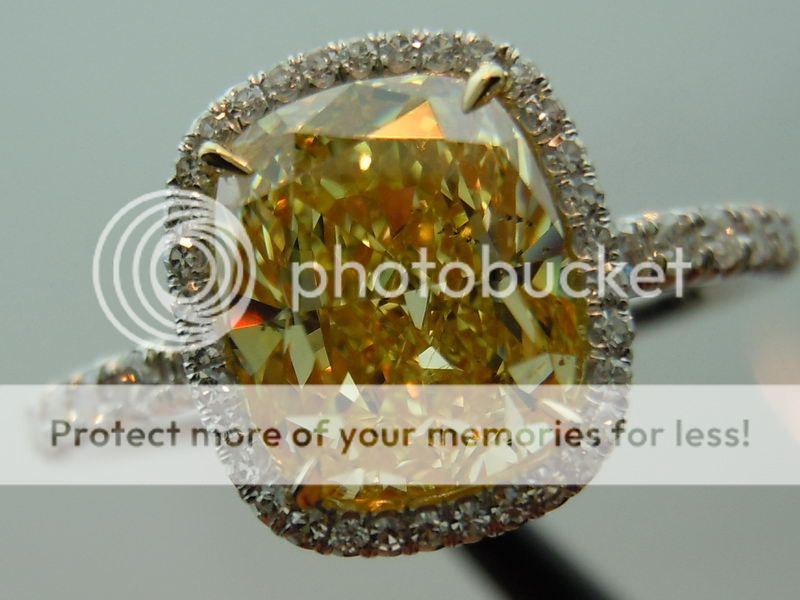 fancy intense yellow diamond engagement ring with halo